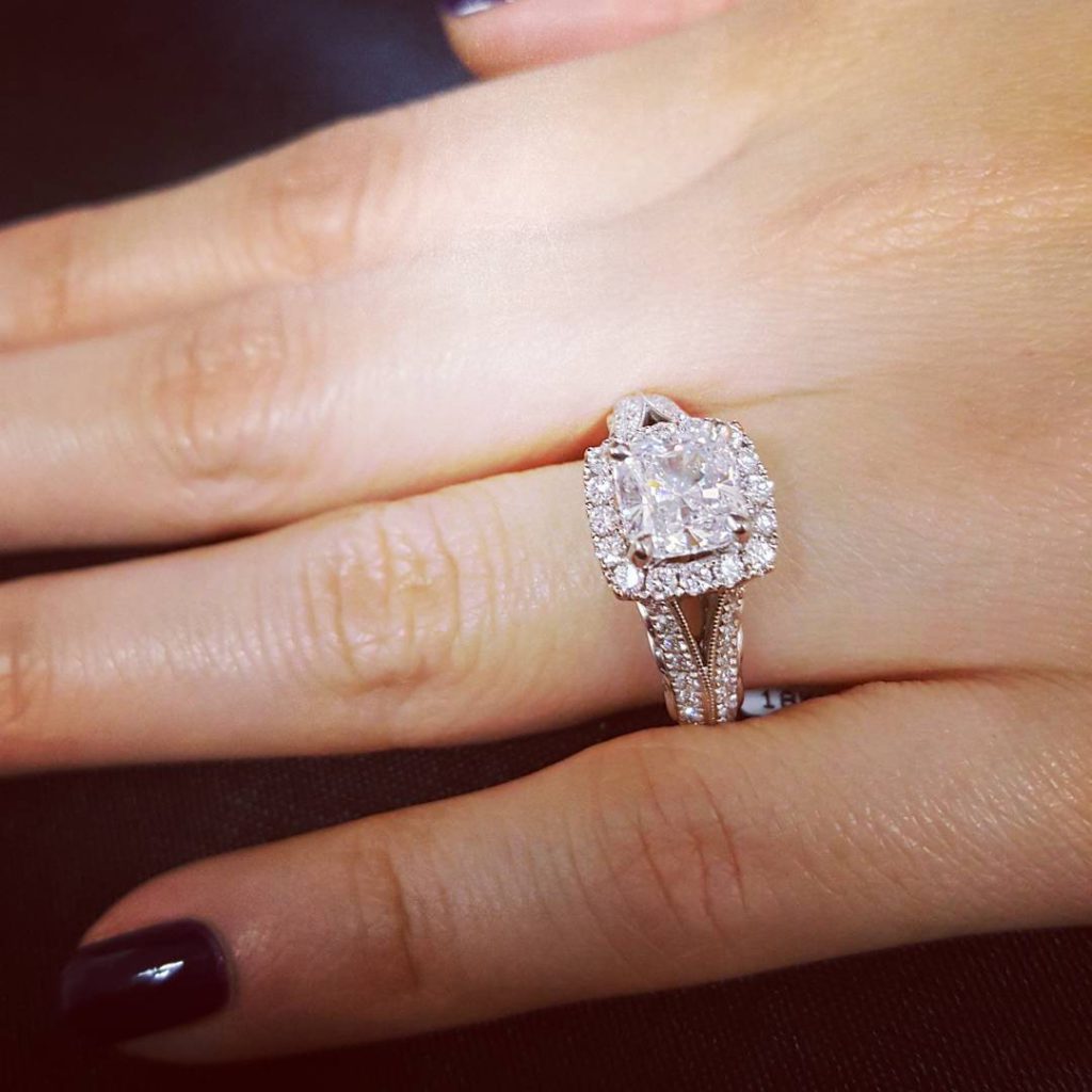 A classic halo diamond engagement ring, this setting will look stunning ...