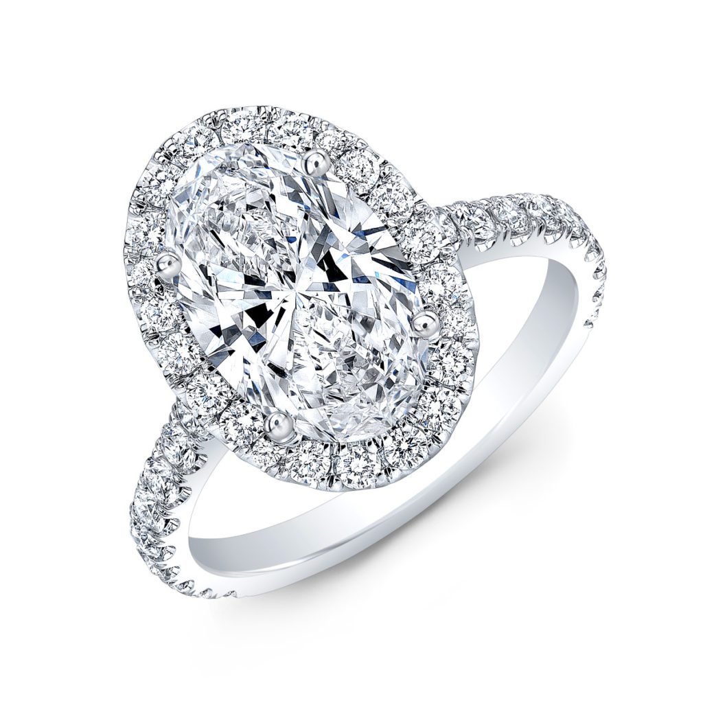 Oval Diamond Engagement Ring with a Halo setting and luminous stones traveling down the shank
