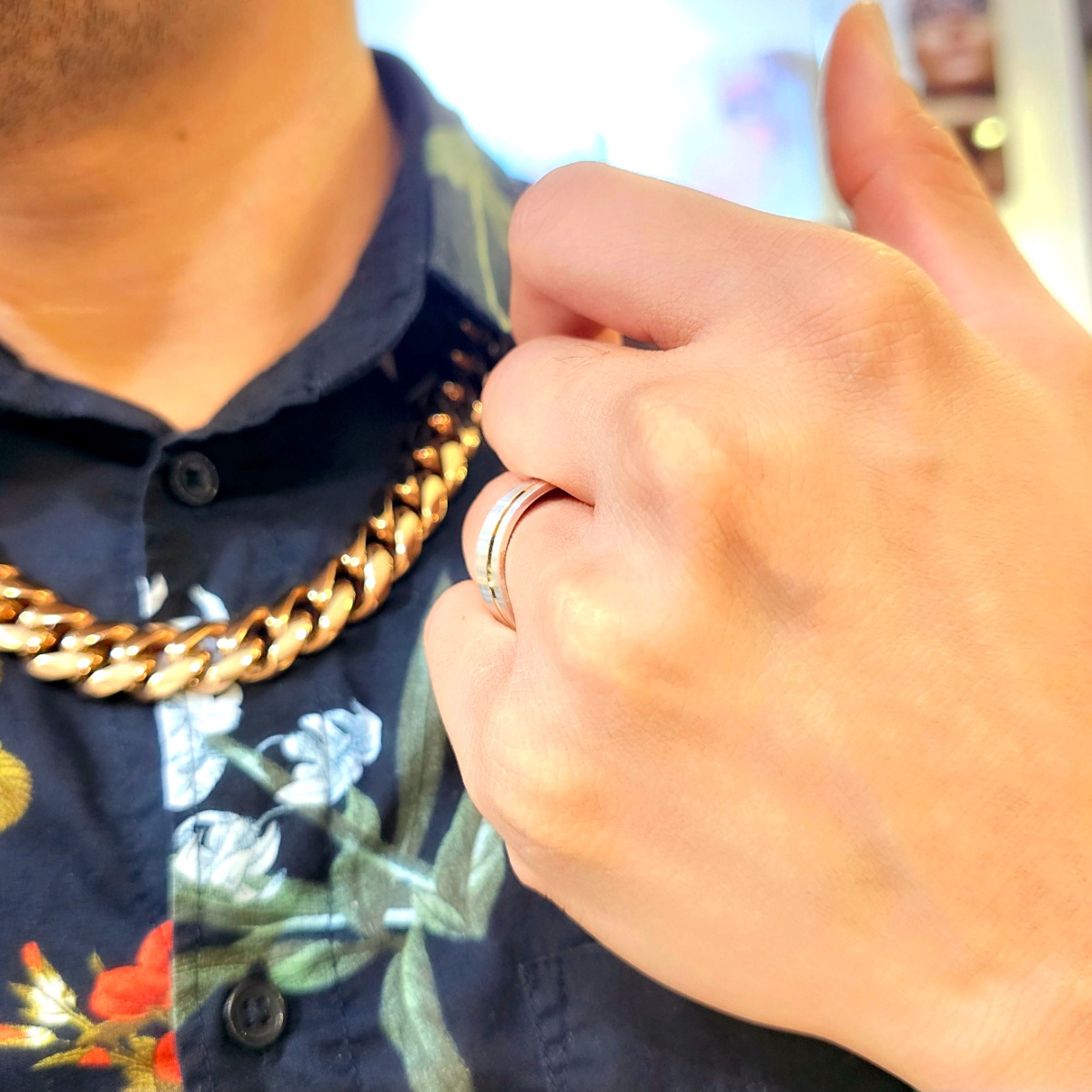 Two toned men's wedding band seen up close from a side angle