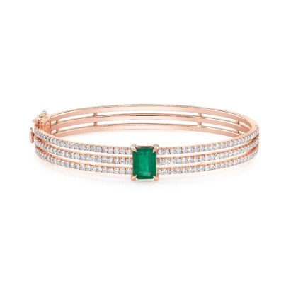 A 7 inch bangle with Green Emerald & Round Diamond Bangle Bracelet in front view.