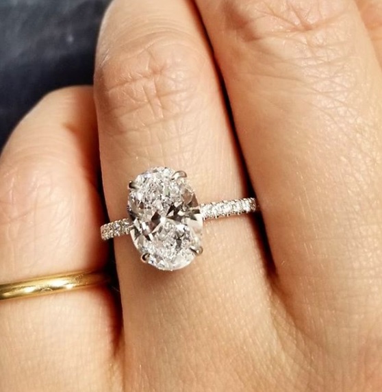 Oval Diamond Ring With a Hidden Halo On Hand
